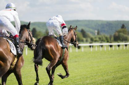 horse jockeys racing