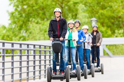 Tourist group having guided Segway city tour