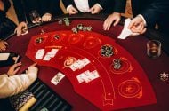 Casino dealer dealing cards and chips