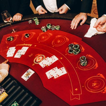 Casino dealer dealing cards and chips