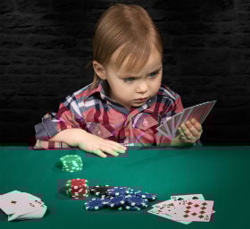 kid playing poker