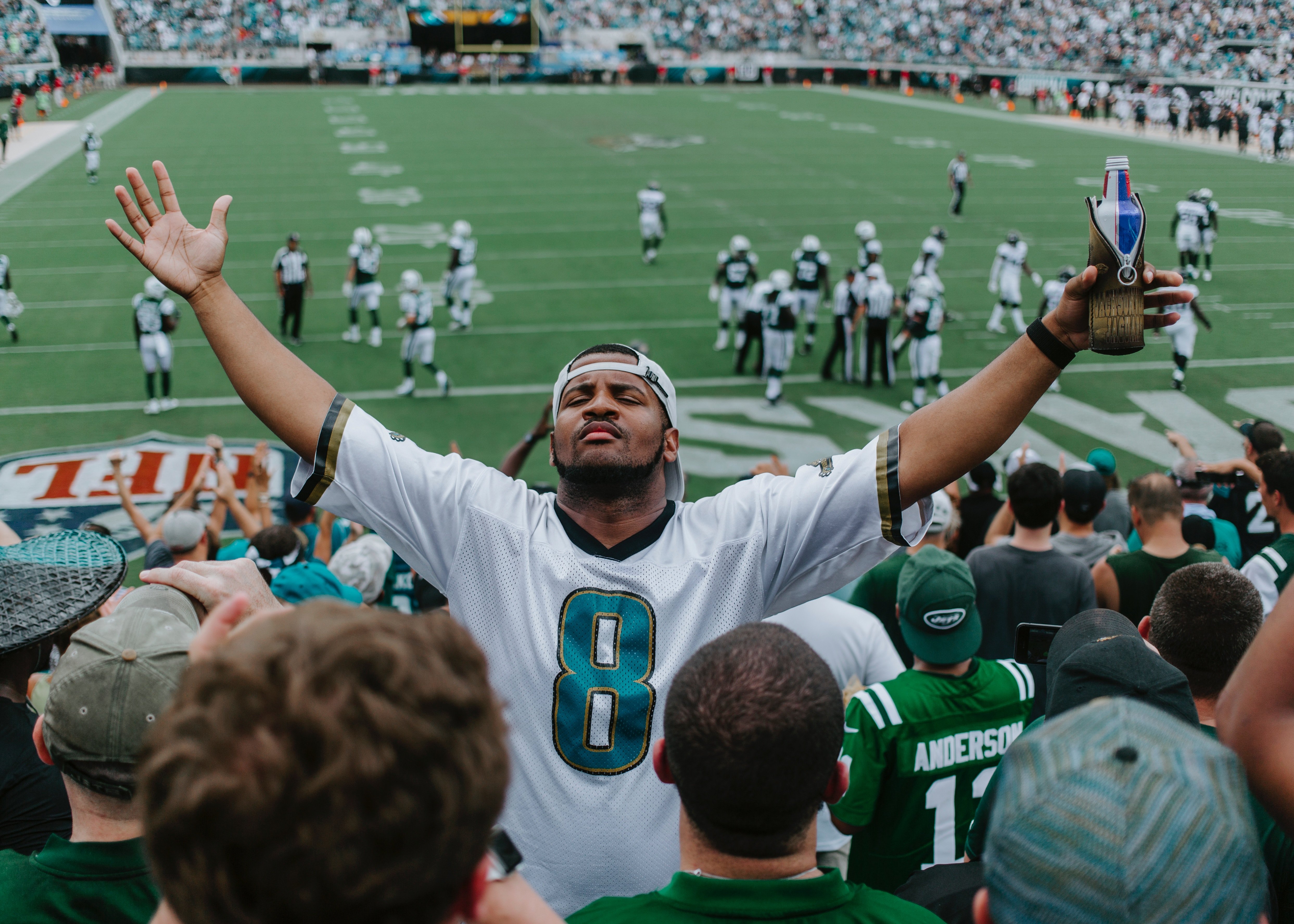 Man cheering NFL game