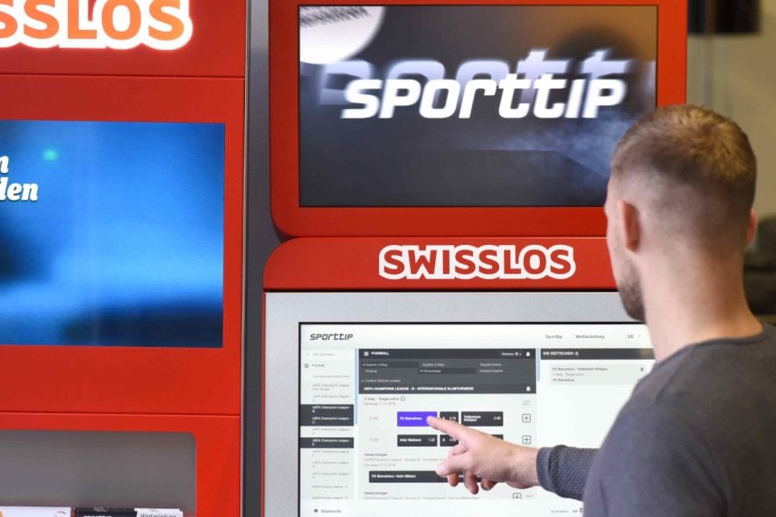 Mann an Sporttip-Wettautomat