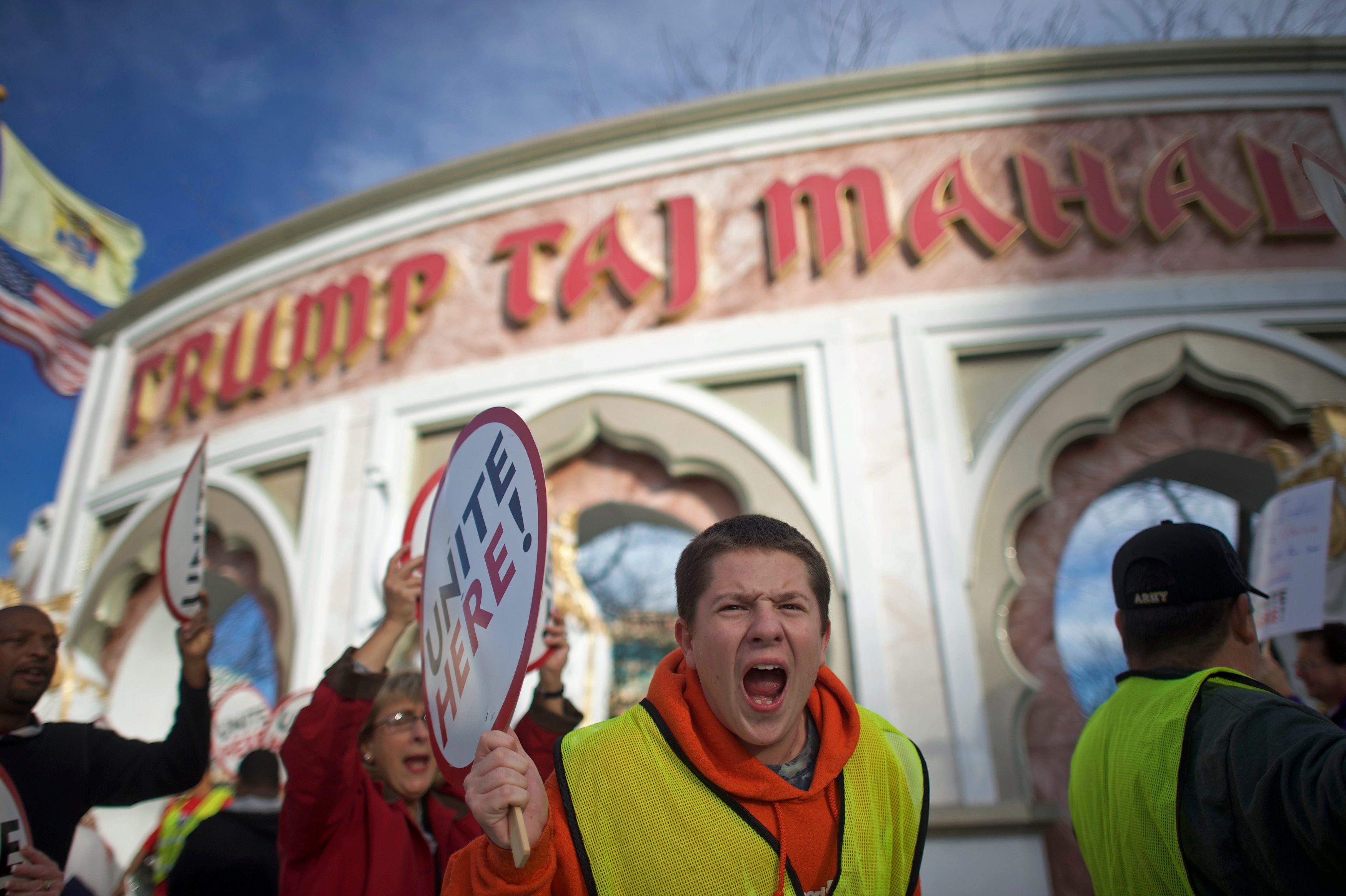 Union members from UNITE HERE Local 54 rally outside the Trump Taj Mahal Casino in Atlantic City, New Jersey