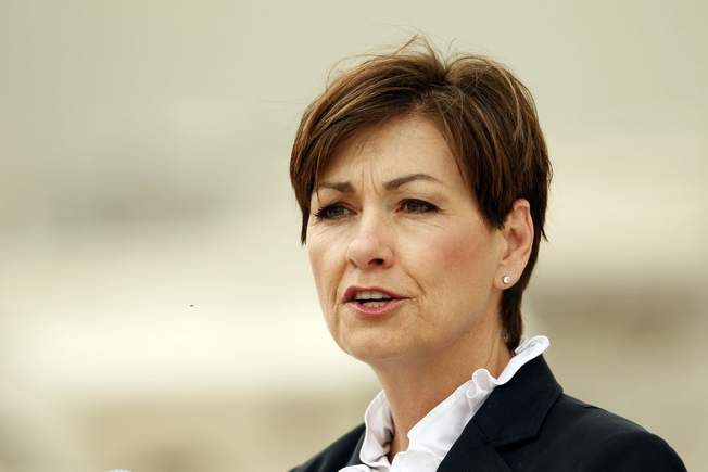 Iowa’s first female governor Kim Reynolds defends use of private jet