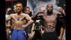 McGregor and Mayweather weigh in