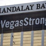 Mandalay Bay Convention Center Attendees Pass Through Hand-Held Metal Detectors at Barrett-Jackson Car Auction