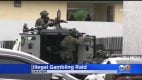 Gaming machines and firearms were seized, police said