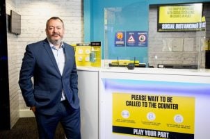 Michael Dugher in a Coral betting shop in London