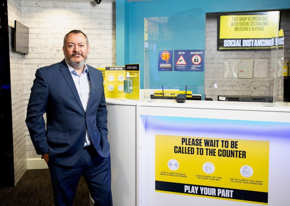 Michael Dugher in a Coral betting shop in London