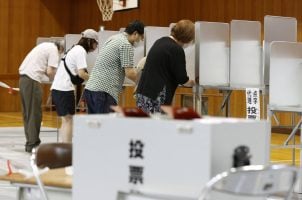 Japanese citizens voting in the polls