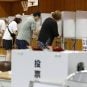 Japanese citizens voting in the polls