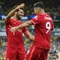 Liverpool’s Mohamed Salah and Roberto Firmino celebrate a goal
