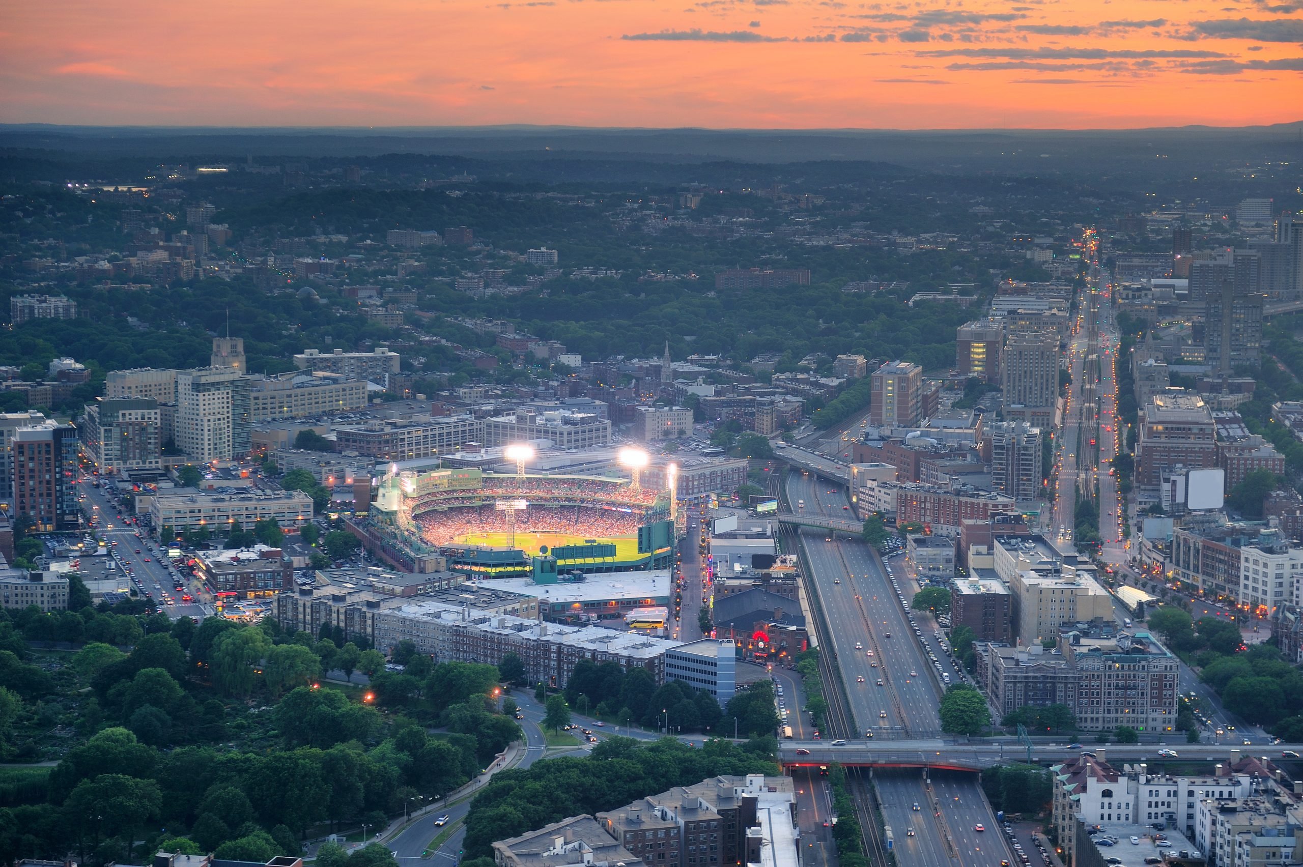 Fenway Park and Kenmore Square in Boston at sunset.