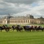 Horses come around a bend at Chantilly