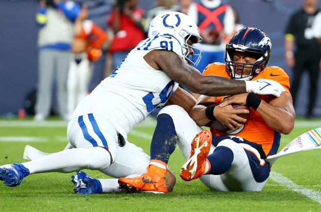 Russell Wilson lat shoulder injury Denverr Broncos QB Colts Chargers Russ