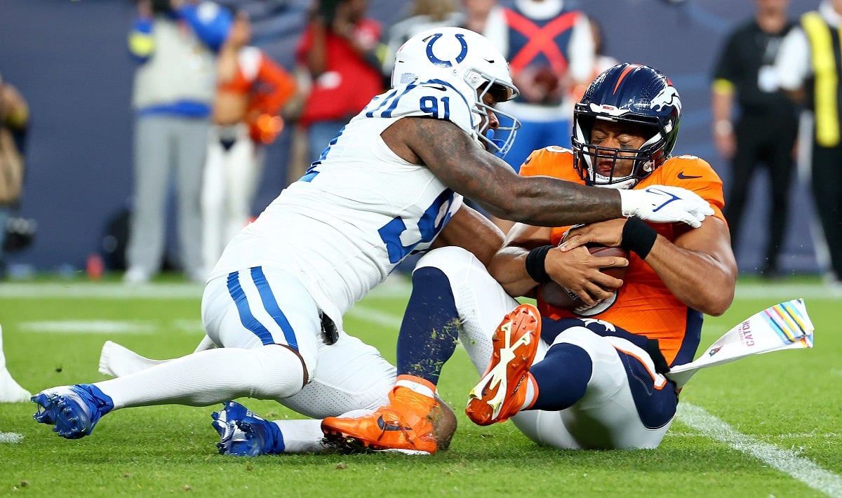 Russell Wilson lat shoulder injury Denverr Broncos QB Colts Chargers Russ