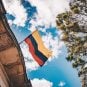 Colombia's flag flies outside a building