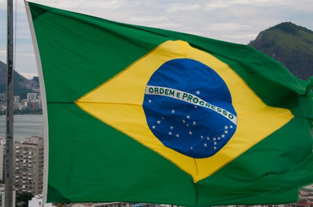 Brazil's flag flies on top of a building