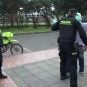 Colombian police search a suspect on the streets