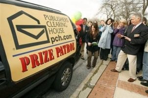 Publishers Clearing House prize patrol van surrounded by locals