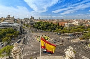 Spanish flag flies at Cybele Palace in Madrid, Spain