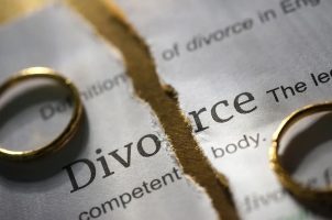 A divorce decree with wedding bands