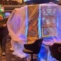 A worker unveils gaming machines at a new casino in Andorra