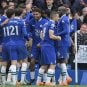Chelsea FC players celebrate on the field.