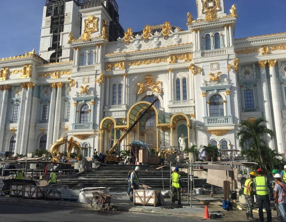 Construction workers work on the Imperial Palace casino in Saipan