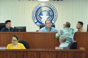 Members of the CNMI House of Representatives discuss budget issues in a session