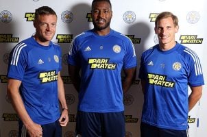 Players with the Leicester City soccer team wear team jerseys sporting sponsor Parimatch