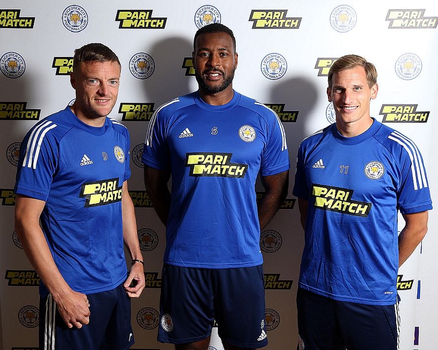 Players with the Leicester City soccer team wear team jerseys sporting sponsor Parimatch