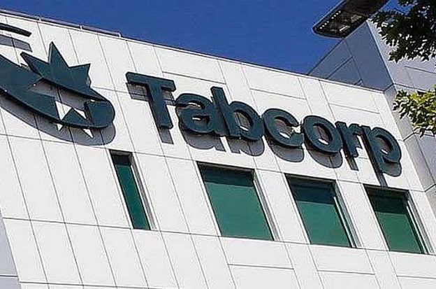 Tabcorp's sign hangs outside its offices