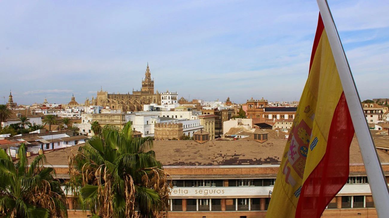 The Spanish flag flies in the foreground