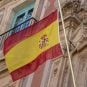 The Spanish flag flies on an old building