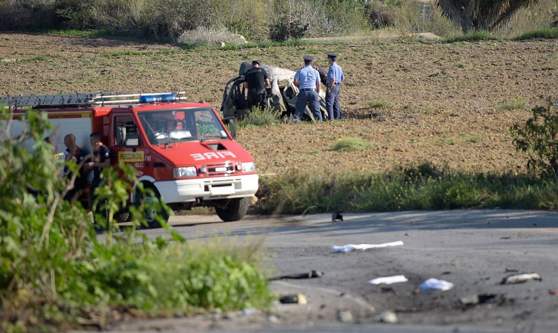 Emergency personnel at the scene of the bombing that killed journalist Daphne Caruana Galizia