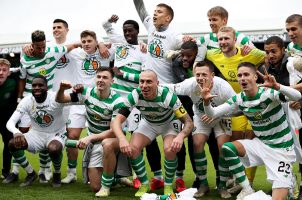 Scotland's Celtic FC team poses for a picture on the field