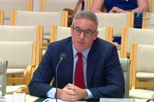 Sportsbet CEO Barni Evans speaks during a hearing on online gaming in Australia