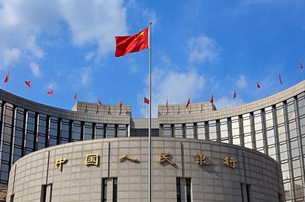 The Chinese flag flies outside the country's central bank