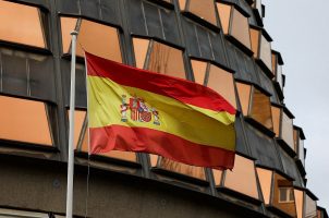 The Spanish flag flies on the Constitutional Court in Madrid