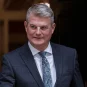 UK Gambling Minister Stuart Andrew in a doorway