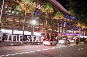 Vehicles line up to drop off guests at a Star Entertainment casino