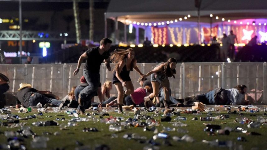 Concert goers run during the deadly mass shooting in Las Vegas