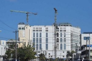 Cranes sit atop the Imperial Palace casino in Saipan two years after construction stopped