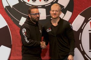 Jason Koon (right) shakes hands with Daniel Negreanu as he's announced as a new GGPoker ambassador.