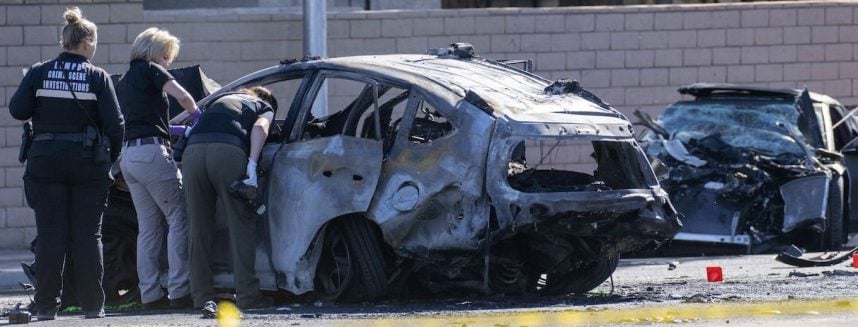 Las Vegas Metropolitan Police Department officers check vehicles