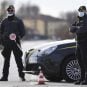 Officers with Italy's financial crimes police conduct a routine patrol