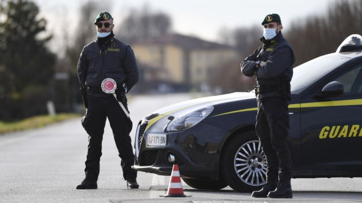 Officers with Italy's financial crimes police conduct a routine patrol