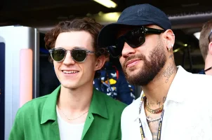 PSG soccer player Neymar (right) takes a photo with actor Tom Holland at the Monaco Grand Prix